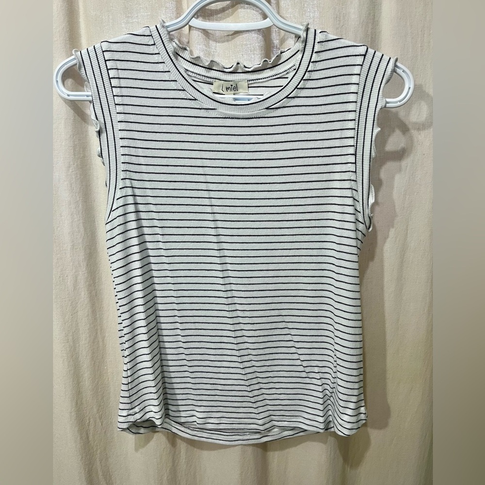 Ribbed white and black striped shirt, ruffle details